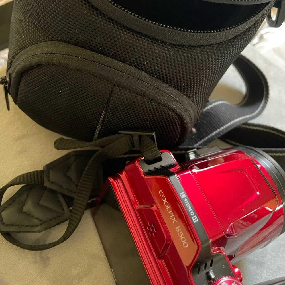 COPY - New Red Nikon camera with the bag.